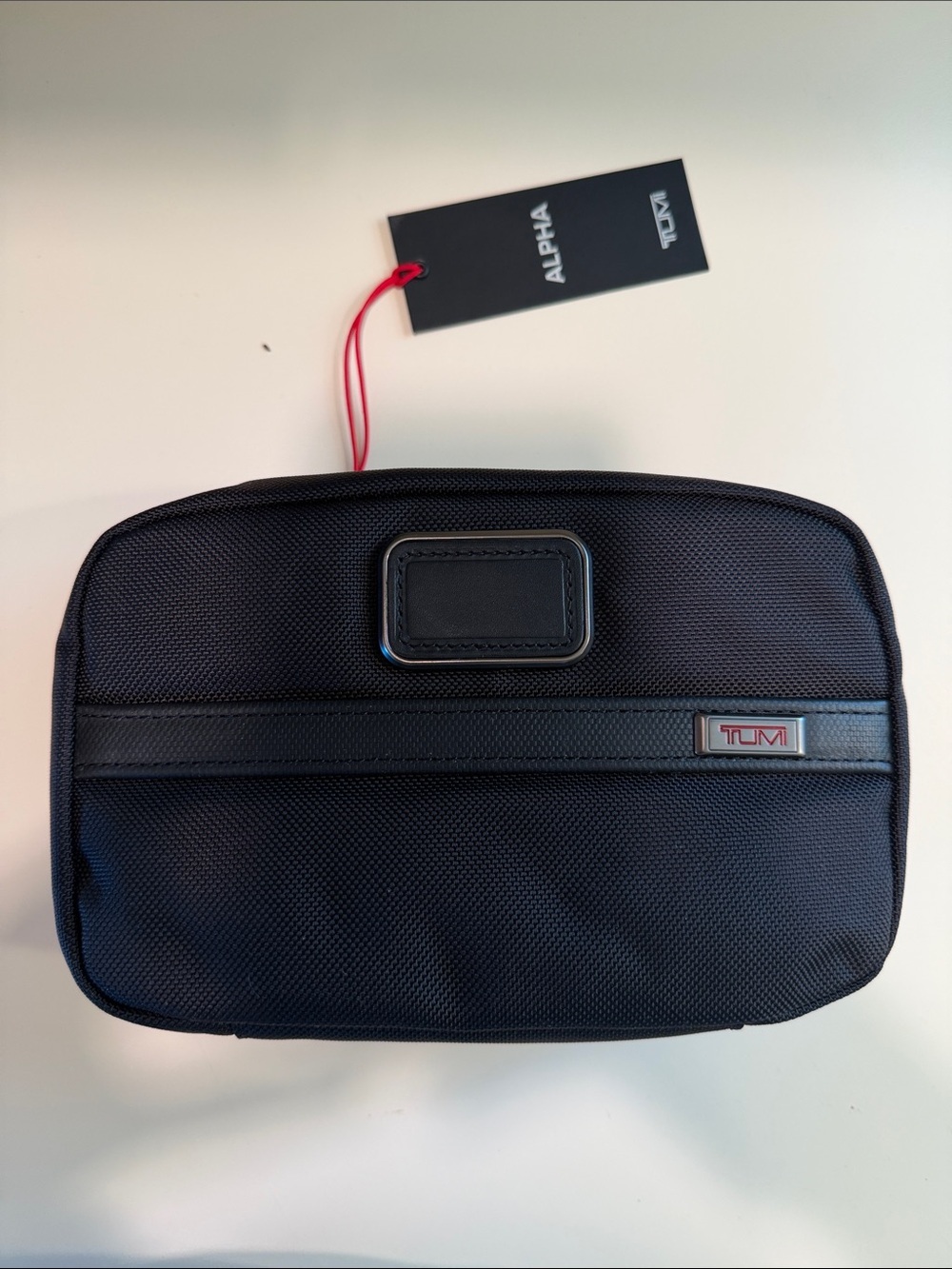 Tumi Black Travel Toiletry Pouch with Red Tag Accent